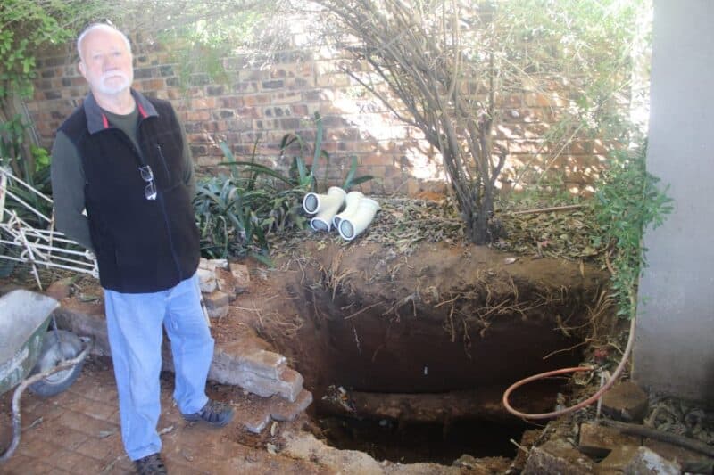 Albertsville resident Alex Voxcroft shows the abnormal root structure that damaged his sewage system on June 7,2026. Photo: Waydon Jacobs