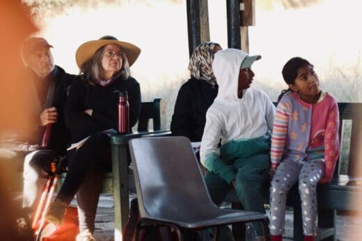 Attendees both young and old listen to Professor Jill Drennan’s talk on rocks on July 5, 2026, at the Melville Koppies Lecture Hut. Photo: Neo Phashe