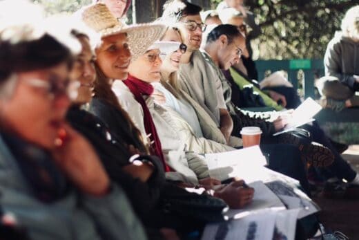 Eager attendees listen as they each have printed images of prehistoric landscapes on July 5, 2026, at the Melville Koppies Lecture Hut. Photo: Neo Phashe