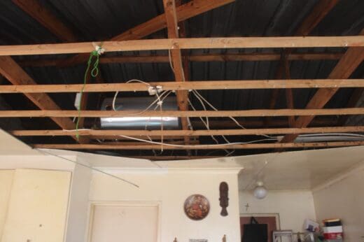 The interior in one of the units Eeufees Oord Retirement Village that is without a ceiling, exposing the roof structure and electrical wiring on July 6, 2026, in Westdene. Photo: Waydon Jacobs