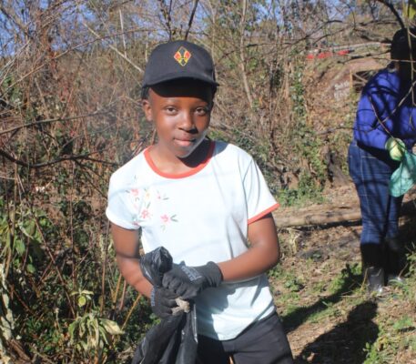 Thando Khuzwayo collects rubbish in Albertsville Park during the Mandela Day clean-up on July 18, 2026. Photo: Waydon Jacobs