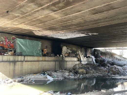 Makeshift shelters erected under the Katherine Street (Sandspruit) Bridge have prompted residents to raise concerns about flood risks, bridge safety, and illegal occupation. Photo: Xoliswa Zakwe