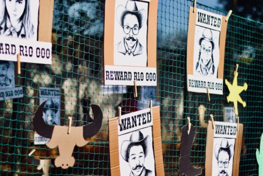 A list of ‘wanted suspects’ line a net. Photo: Neo Phashe