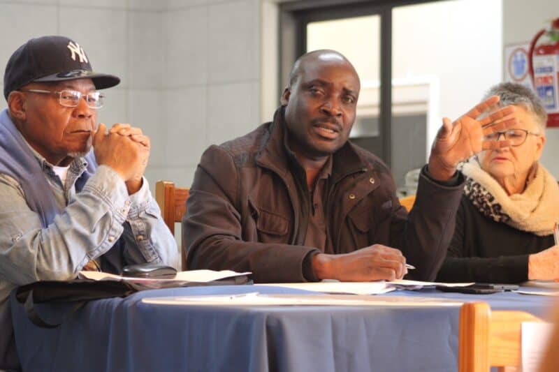 Izaki Mohamed, Sector 4 manager of Sophiatown SAPS, Sergeant Benneth Maluleke, and Sheryl Hodgkins listen to the community's concerns of Ward 86 on August 1, 2026. Photo: Waydon Jacobs