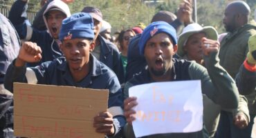 Protesters display placards reading ‘Feed Our Families’ and ‘Pay Mapitsi’ as contractors demand payment after alleging they have gone unpaid for more than three months on August 7, 2026. Photo: Waydon Jacobs