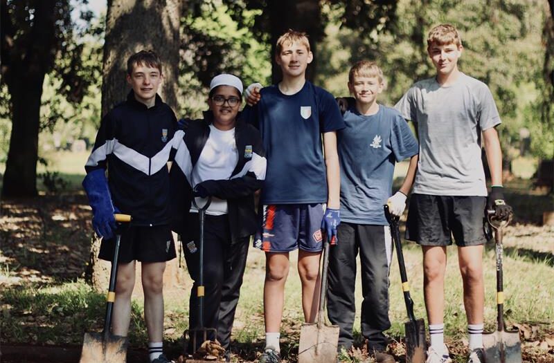 The boys joined Friends of Johannesburg Cemeteries for a clean-up at the cemetery, working among graves and headstones that record generations of the city’s past.
