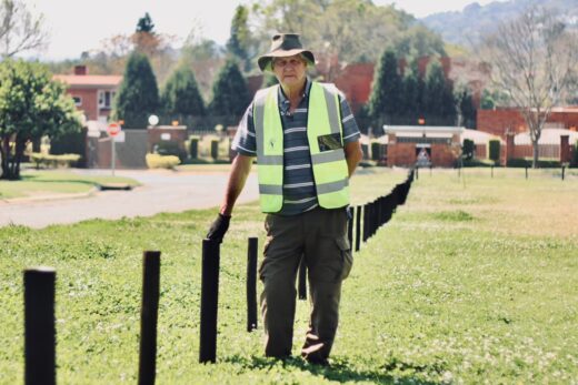 André Swanepoel stands by the donated gum poles in Union Jack Park. Photo: Neo Phashe