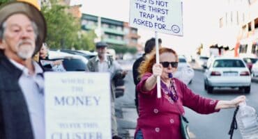 Jill Dinneen, a resident for 10 years, blows a whistle during the protest on September 14, 2026 in Melville. Photo: Neo Phashe
