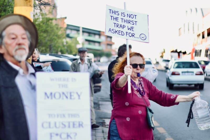Jill Dinneen, a resident for 10 years, blows a whistle during the protest on September 14, 2026 in Melville. Photo: Neo Phashe
