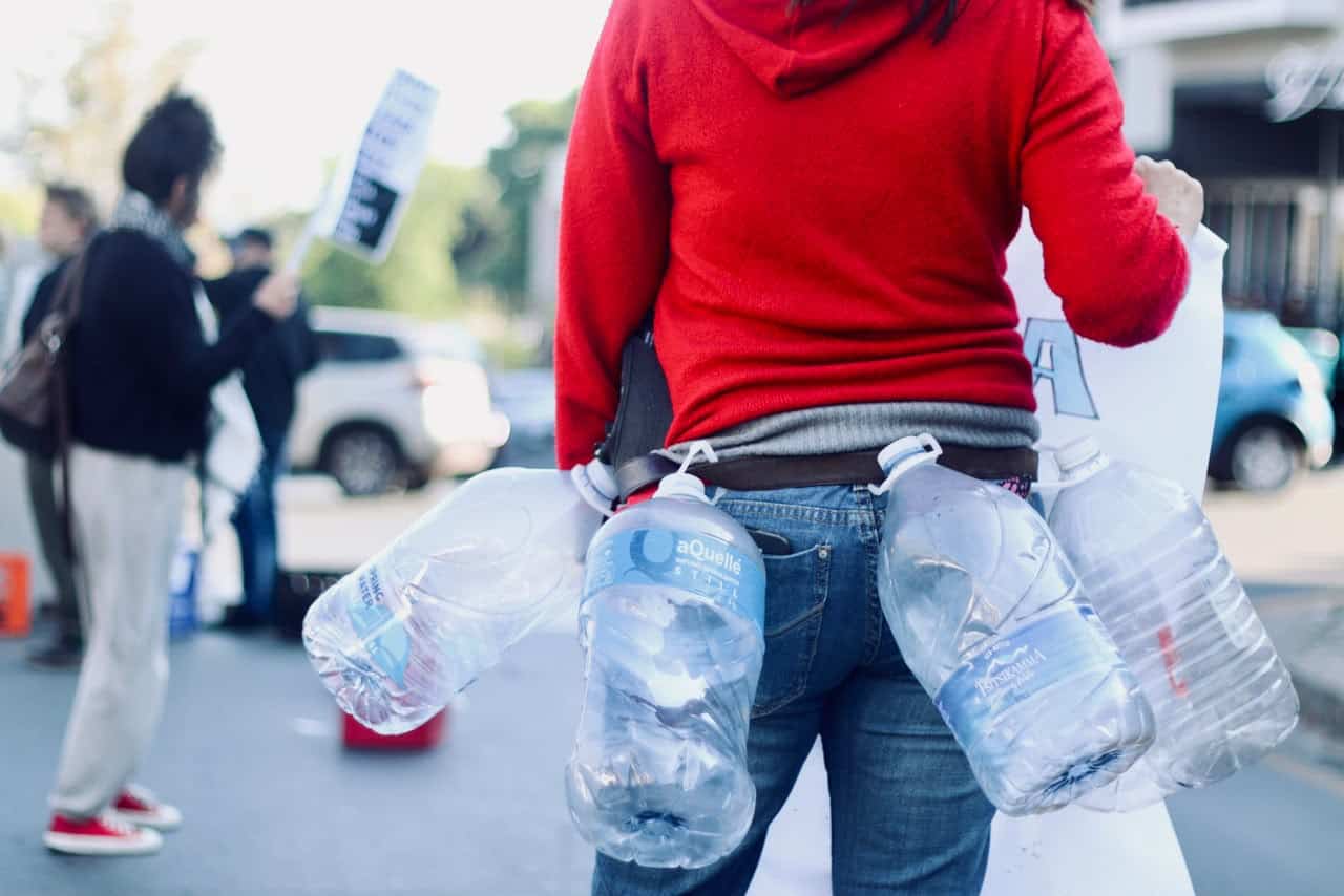Zsofia Borsanyi wears empty bottles around her waist on September 14, 2026, in Melville. Photo: Neo Phashe