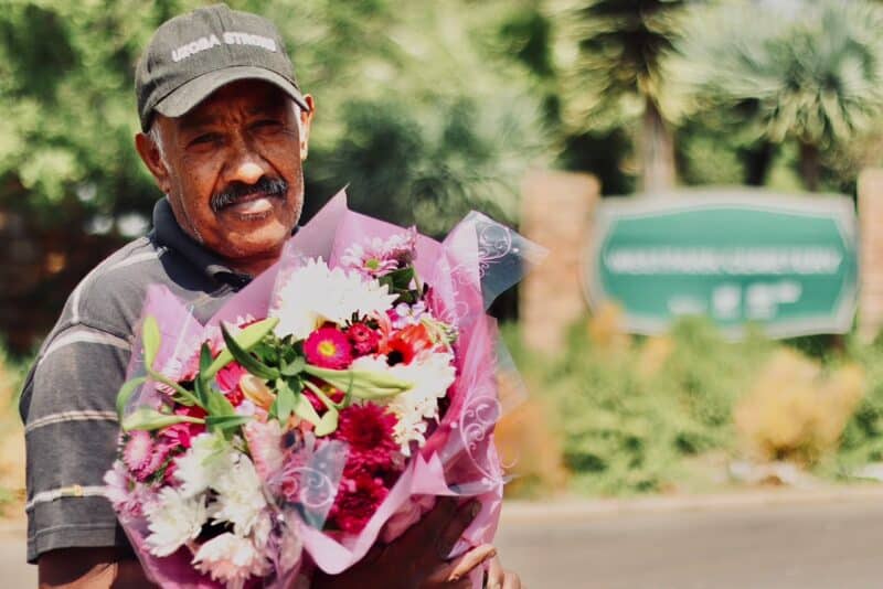 From greeting government ministers to warning visitors about safety inside the grounds, a familiar face explains why the community keeps him going.