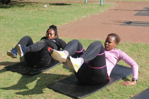 Pakwane Makoela and Lehlogonolo Shadung work on their core strength during an outdoor workout session on October 10, 2026, in Brixton. Photo: Waydon Jacobs