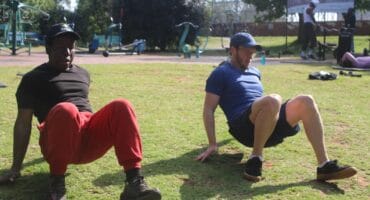Dennis Dlomo (left) and Alex Spoor take part in a bodyweight exercise session on October 10, 2026, in Brixton. Photo: Waydon Jacobs