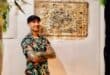 Busta Boltoon stands at one of his art pieces on October 18, 2026 at the Stokvel Gallery at 27 Boxes in Melville. Photo: Neo Phashe