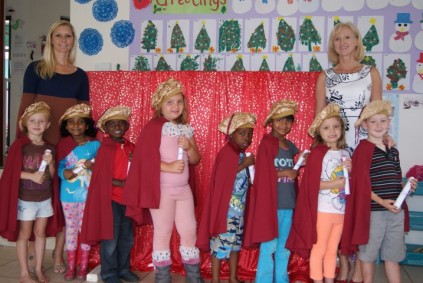 Celebrating a their grade R graduation, from left, Sheffield Beach Pre Primary pupils Chloe Callaghan, Anezka Arthur, Vinesen Subramunier, KC Addison, Anele Nacobo, Riddhi Ramcharan, Mia Abrie and Jamie Steyn, between Principal Jackie van Dyk and teacher Andrea Sharrock.