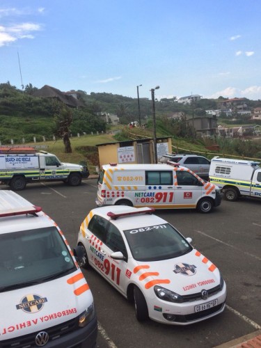 Emergency service vehicles at the beach. 