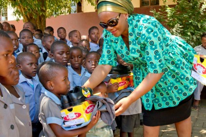 The MEC hands out uniforms to grade R pupils at Sigedleni Primary School.