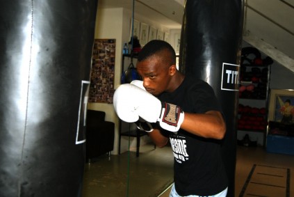 David Rajuili trains with a punching bag.