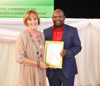 Retired museum curatrix AJ Pretorious, who served for 21 years, receives her award.