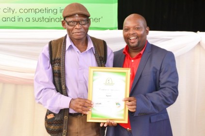Former KwaDukuza artisan K Ngidi is awarded for two decades of service.
