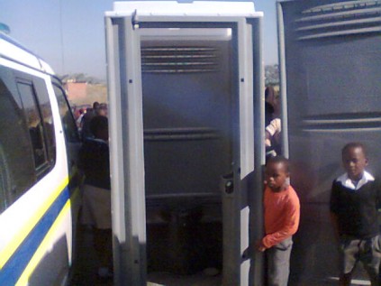 Protesters used mobile toilets to block the road.