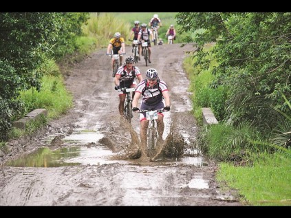 A rider goes through a muddy section at Holla Trails.