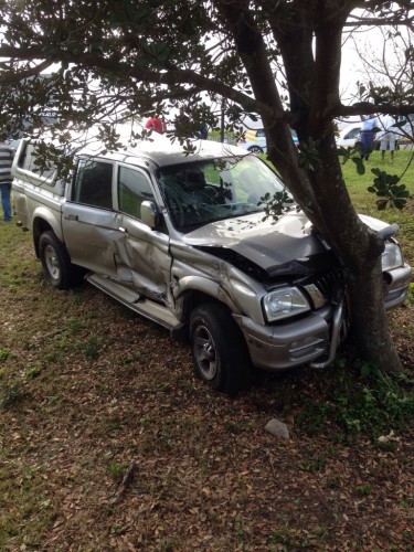 One of the vehicles A light delivery vehicle left the road and crashed against a tree following the collision.  Photo: Netcare 911.