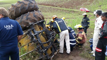 Rescue workers extract the body of the driver from the wreckage. Photo: IPSS Medical Rescue