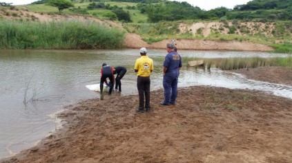 Police recover the body of the boy that drowned in the Umvoti River. Photo: IPSS Medical Rescue