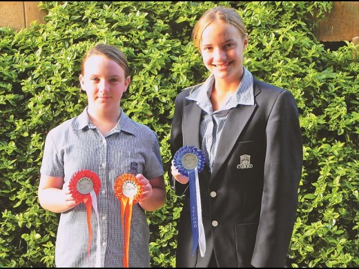 Sonique Mouton and Franche Muller with their rosettes.