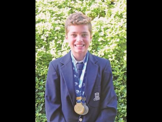 Young swimmer Henk Heymans with his medals.