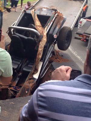 The beach buggy being pulled from the sinkhole. Photo: Megan Clark