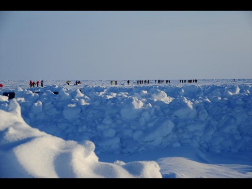 The runners have to run over bolders of ice and snow on the route.