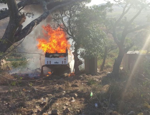 Community members set the bus alight. photo: IPSS Medical Rescue