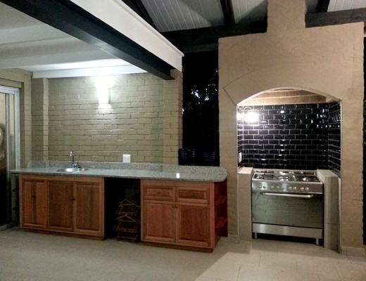 This is an example of an outdoor patio with a gas stove for cooking food outside while socialising with friends or family.