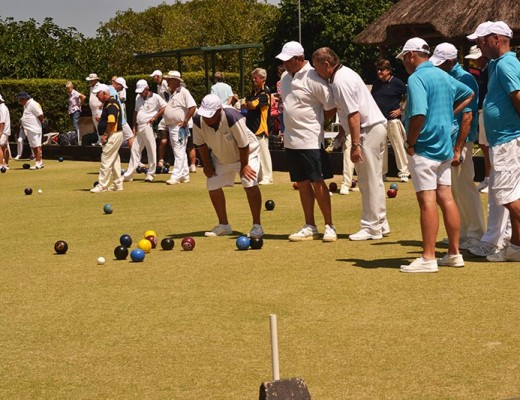 Bowlers holding their breath as a wood rolls into place.