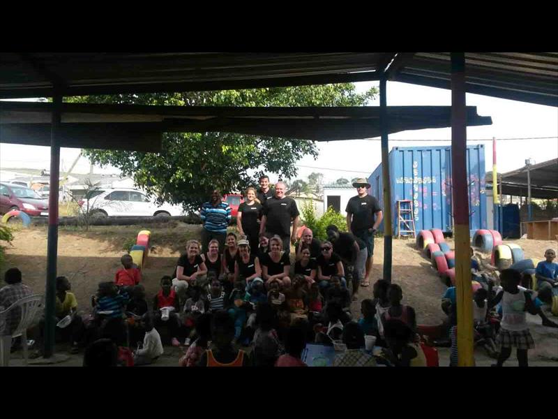 The ConninghamLee staff with the children at the Word of Hope centre.