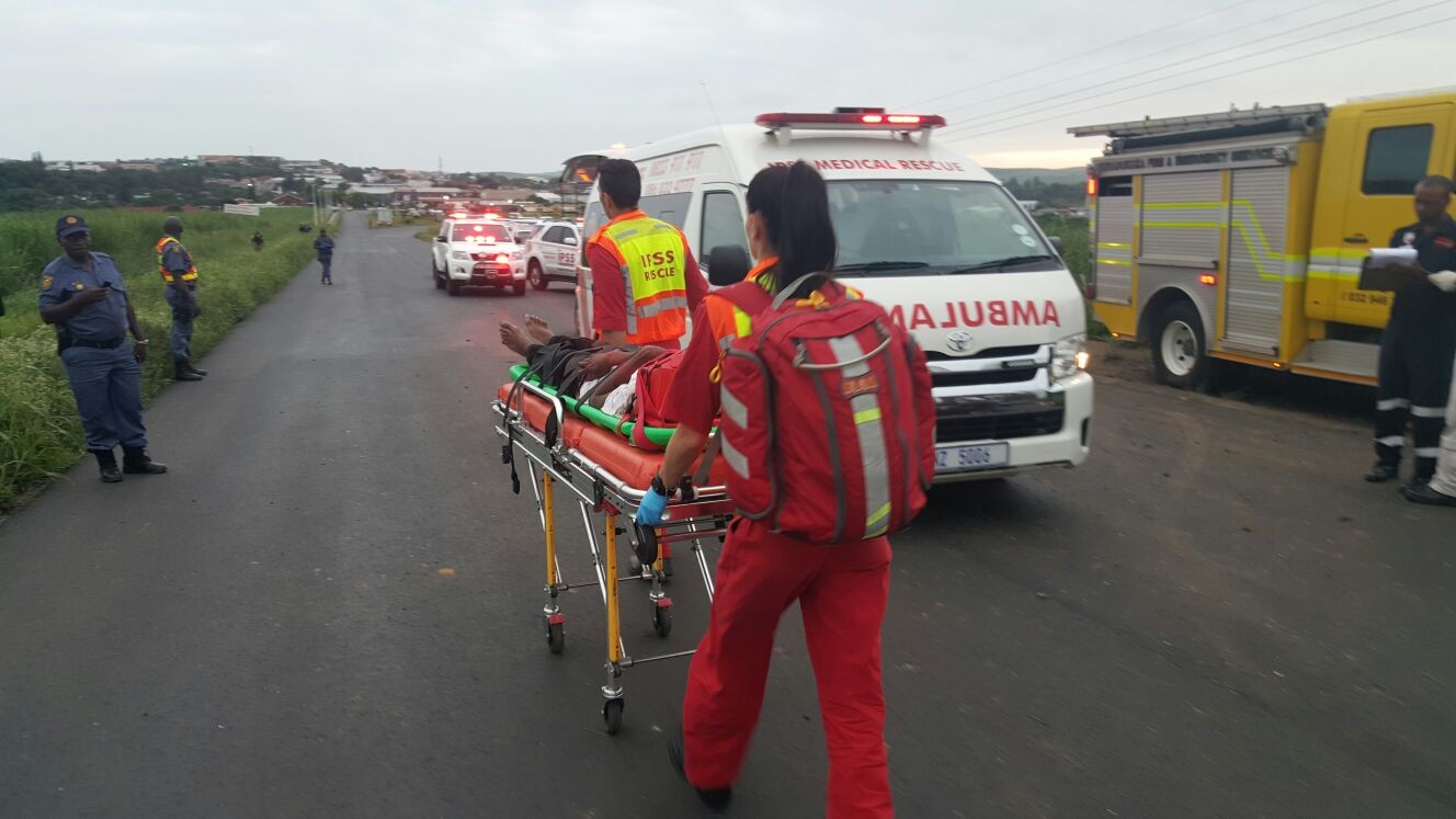 Paramedics carrying a patient to the ambulance. Photo: IPSS Medical Rescue 