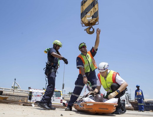The patient is carefully attached to the crane. Photo: Netcare 911.