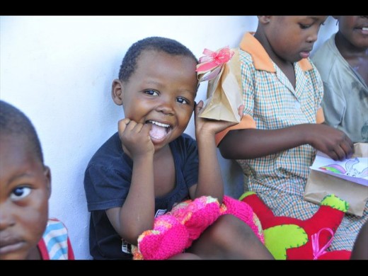 A shy smile from one of the beautiful little girls of Rose Zwane's Safe Haven for Children and Elders.