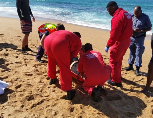 Paramedics working to save a near drowning victim's life.