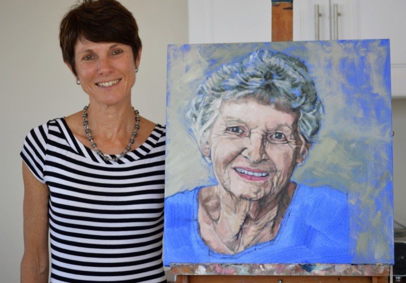 Janine Goes with a painting she made of her mother.