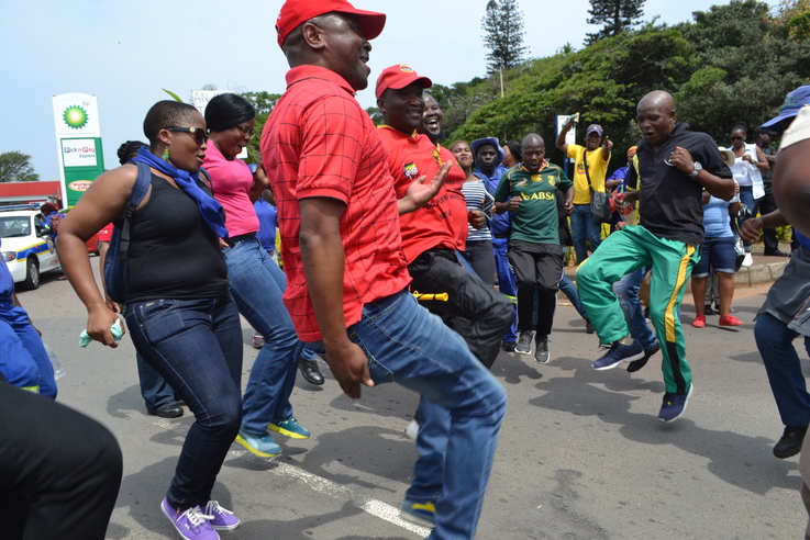 Municipal workers toyi-toyi through the streets of Ballito.