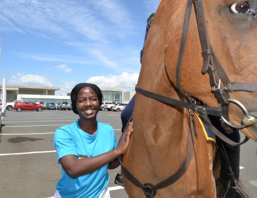 Emma Matare from Zara's Cafe meets one of the beautiful police horses, Kerneels.