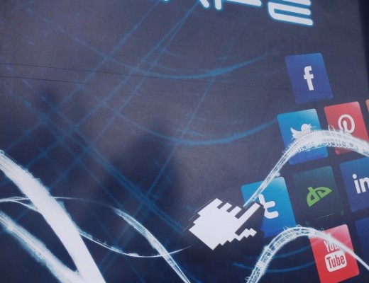 The windows outside the Inet Cafe depicts social media symbols.