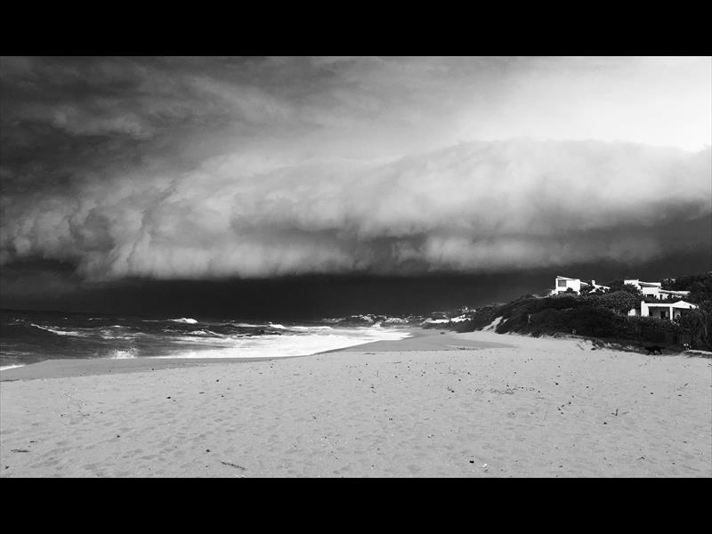 In first place is Charles Southwood with his amazing black and white photograph of storm clouds gathering on November 12 at Salt Rock beach.