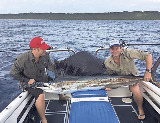 Kelly Smith (right) landed this nice saily (sailfish) at Cape Vidal over the weekend. The fish took a live “mozzie” bait and was released after the photo was taken. Rob Wacher (left) helps to hold the powerful fish.