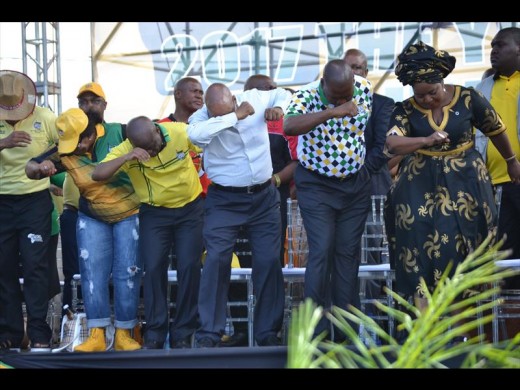 ANC party heads dance on stage at the ANC's 105th birthday anniversary celebration on Sunday.