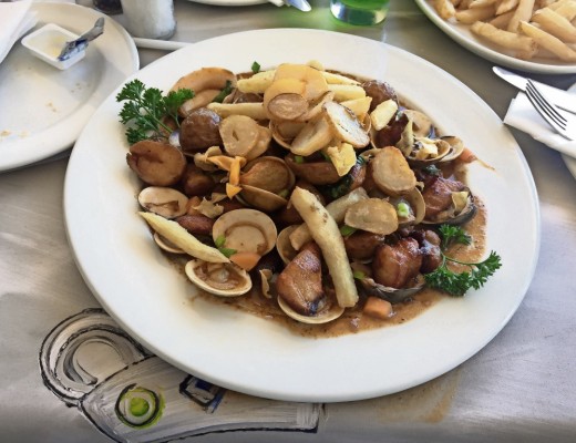 A healthy portion of pork belly with clams and chorizo