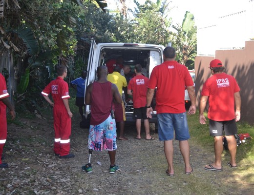 IPSS advanced life support members and KDM lifeguards loading Ayanda into the ambulance.
